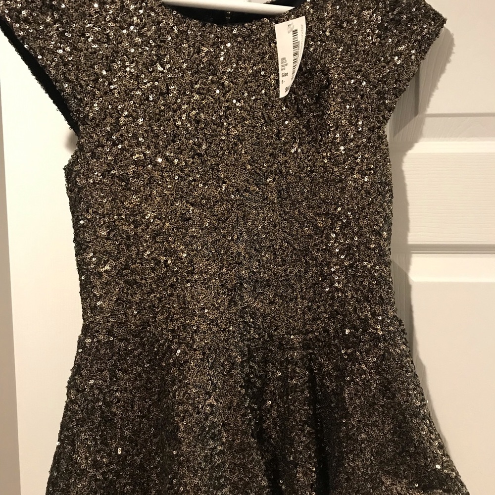 NWT- Sequin peplum blouse.